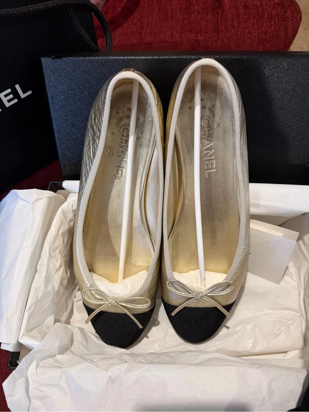 CHANEL Gold Leather Ballet Flats with Black Cap Toe Winter 2025 Season
